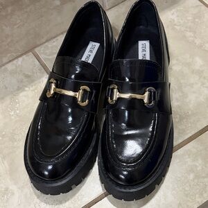 Steve Madden Glossy Black Loafers with Gold Accent